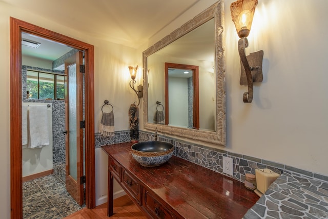 bathroom with vanity and wood finished floors