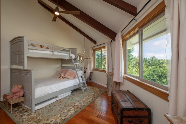 bedroom featuring vaulted ceiling with beams and wood finished floors