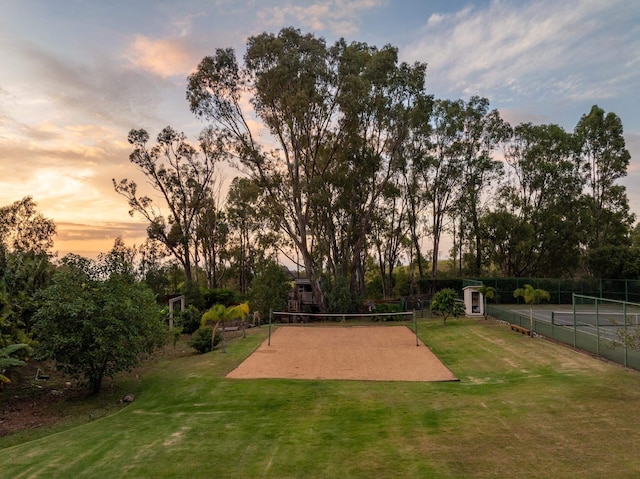 surrounding community featuring fence, a yard, and volleyball court