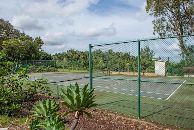 view of sport court with fence