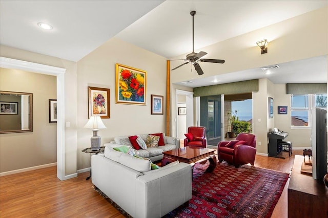 living room featuring ceiling fan, visible vents, wood finished floors, baseboards, and recessed lighting
