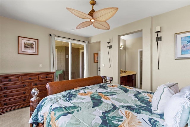 bedroom with carpet floors, a ceiling fan, and ensuite bathroom