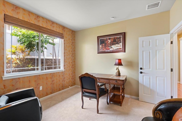 office space featuring carpet flooring, wallpapered walls, visible vents, and baseboards