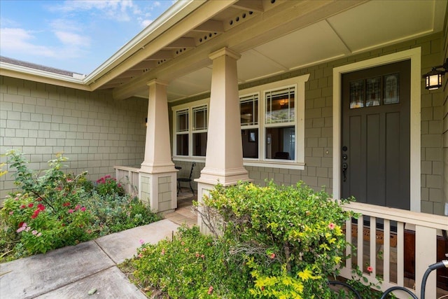 property entrance featuring a porch