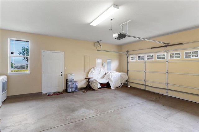 garage featuring a garage door opener and electric panel