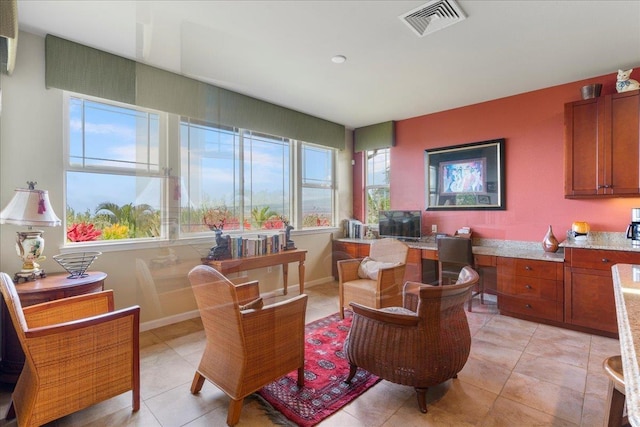 interior space featuring visible vents, baseboards, and light tile patterned flooring