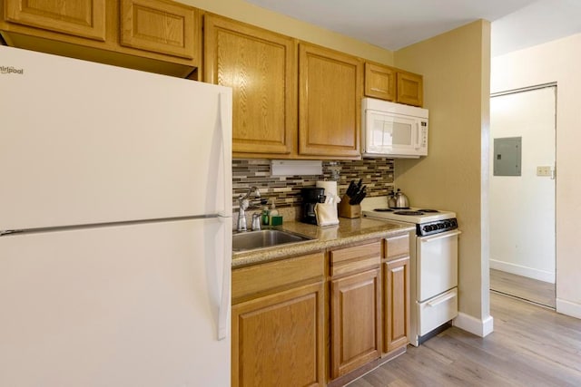 kitchen featuring light hardwood / wood-style floors, decorative backsplash, electric panel, sink, and white appliances