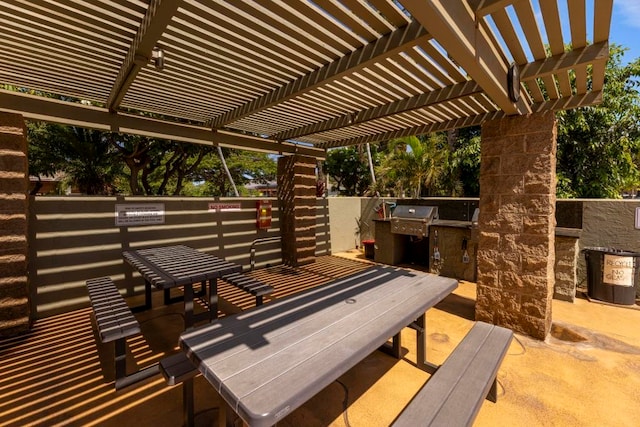 exterior space featuring a pergola and a grill