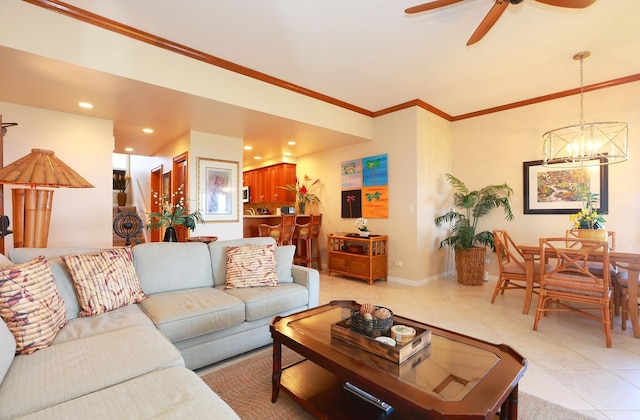 living room featuring light tile patterned floors, recessed lighting, baseboards, ornamental molding, and ceiling fan with notable chandelier