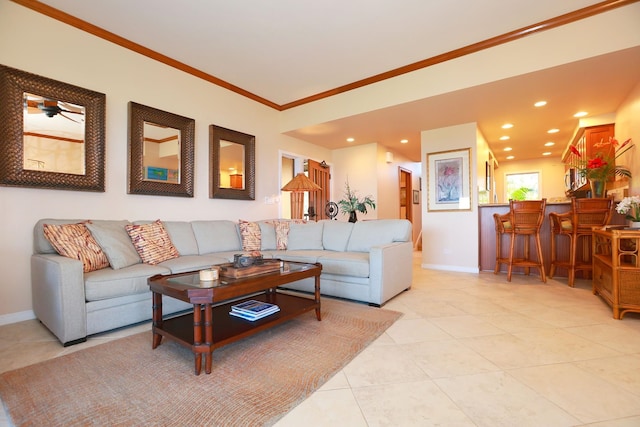 living area with light tile patterned floors, baseboards, crown molding, and recessed lighting