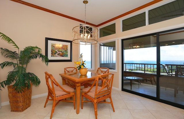 dining space with baseboards, ornamental molding, a water view, a notable chandelier, and light tile patterned flooring