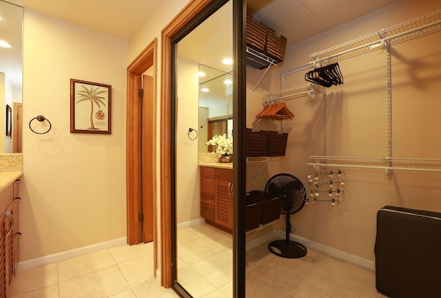 spacious closet with light tile patterned flooring