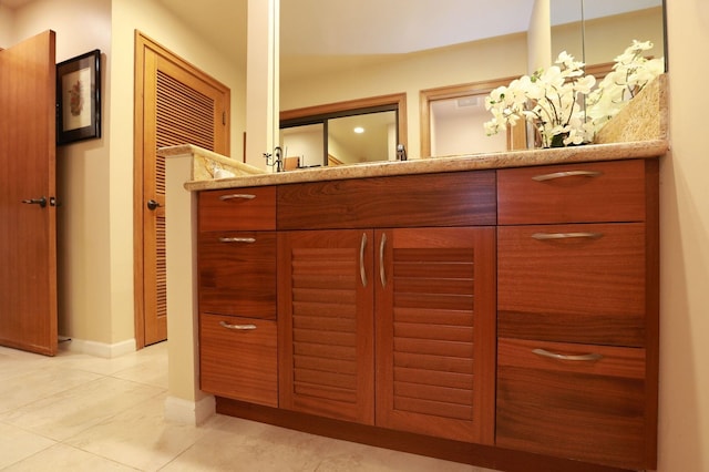 interior space featuring baseboards and vanity