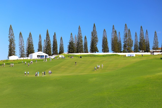 surrounding community with view of golf course