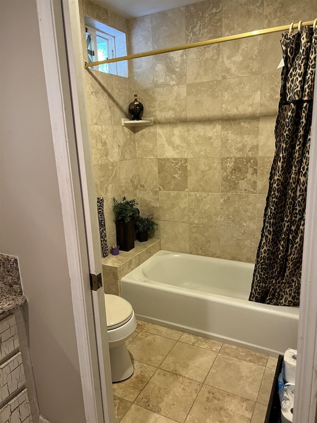 bathroom with tile patterned flooring, toilet, and shower / tub combo with curtain