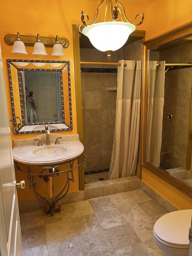 full bath featuring a shower stall and toilet