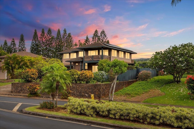 view of front of home with a balcony