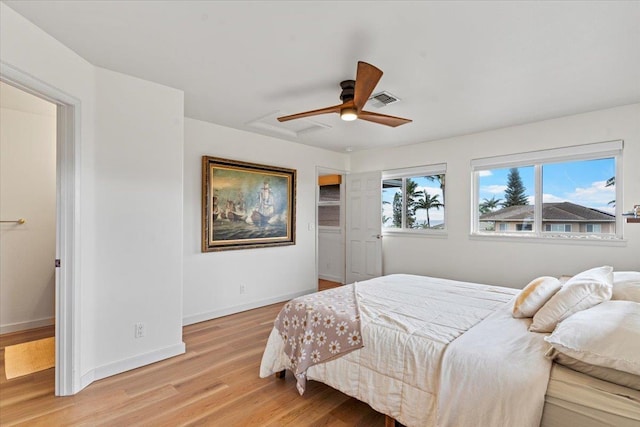 bedroom with ceiling fan and light hardwood / wood-style floors