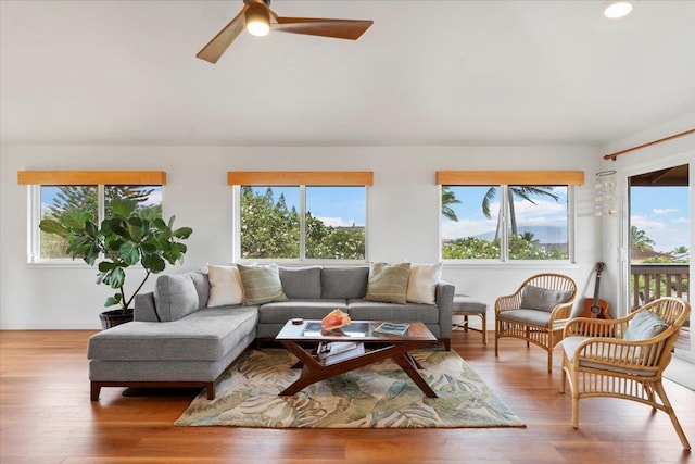 sunroom / solarium with a wealth of natural light and ceiling fan