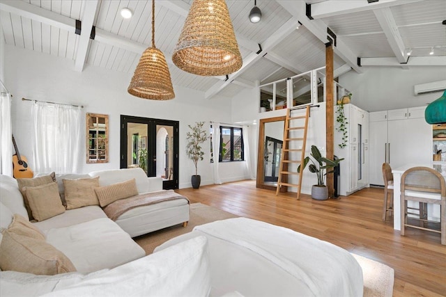 3291 Waileia Pl, Kihei, HI 96753 - living area featuring french doors, light wood-style floors, high vaulted ceiling, beamed ceiling, and a wall mounted AC
