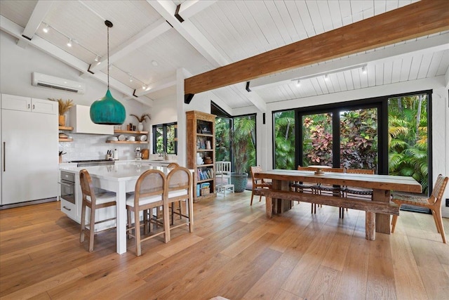3291 Waileia Pl, Kihei, HI 96753 - dining area featuring a wall mounted AC, light wood-type flooring, and wood ceiling