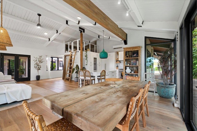 3291 Waileia Pl, Kihei, HI 96753 - dining area with french doors, light wood-style flooring, an AC wall unit, and stairs