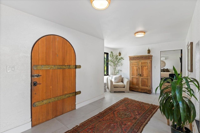 entrance foyer featuring light tile patterned floors