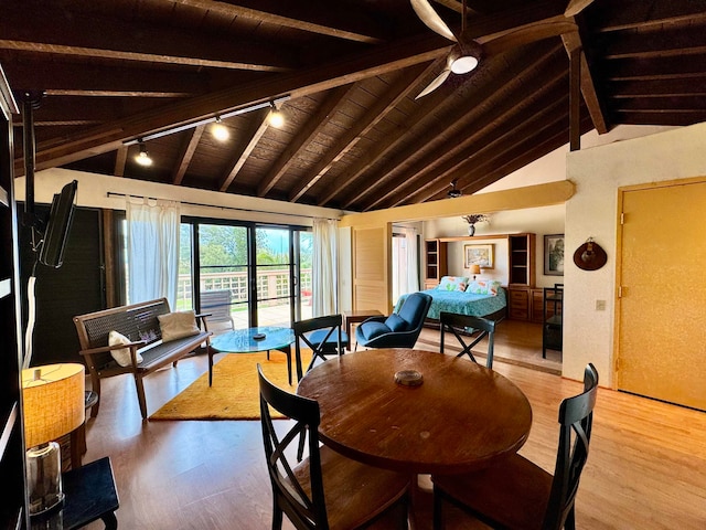 dining area featuring wood ceiling, ceiling fan, beamed ceiling, and hardwood / wood-style floors