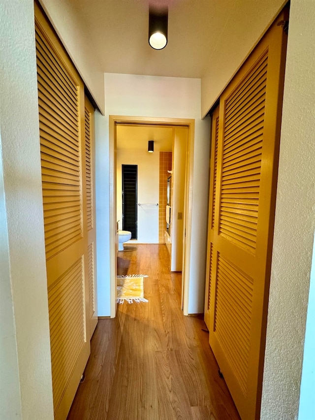 corridor featuring hardwood / wood-style flooring