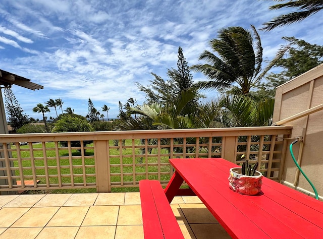 wooden terrace featuring a yard