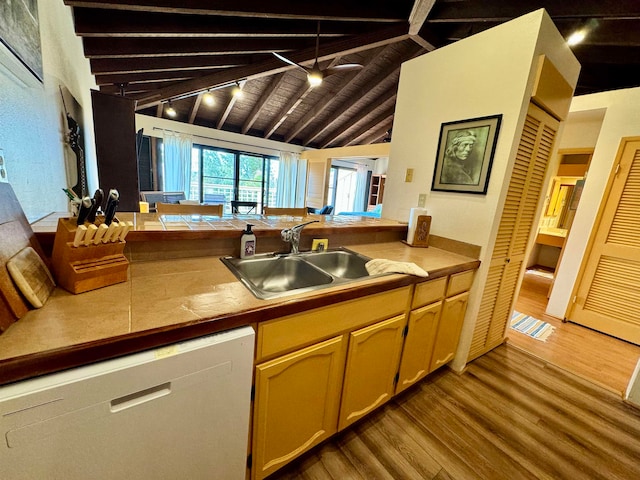 kitchen with hardwood / wood-style floors, beam ceiling, sink, wood ceiling, and dishwasher