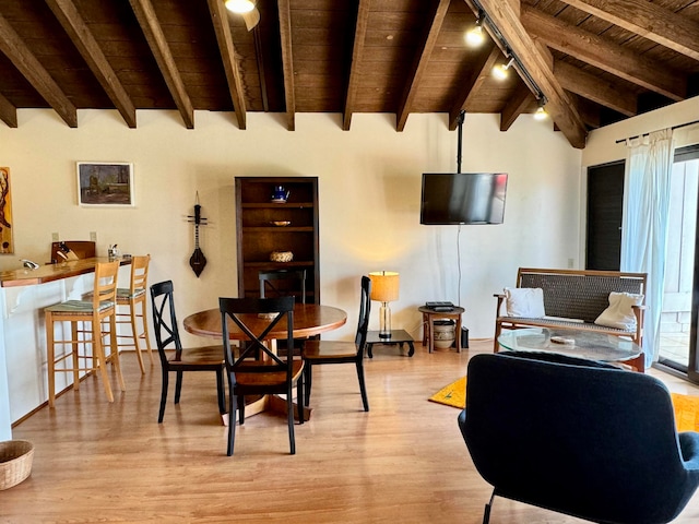 dining area with rail lighting, wooden ceiling, lofted ceiling with beams, and light wood-type flooring