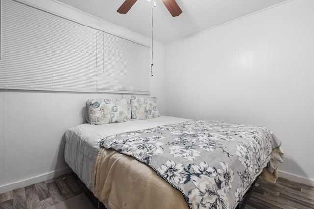 bedroom featuring dark hardwood / wood-style floors and ceiling fan