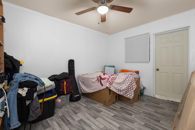 bedroom with ceiling fan and hardwood / wood-style flooring