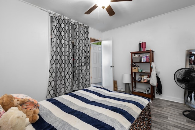 bedroom featuring ceiling fan and dark wood-type flooring