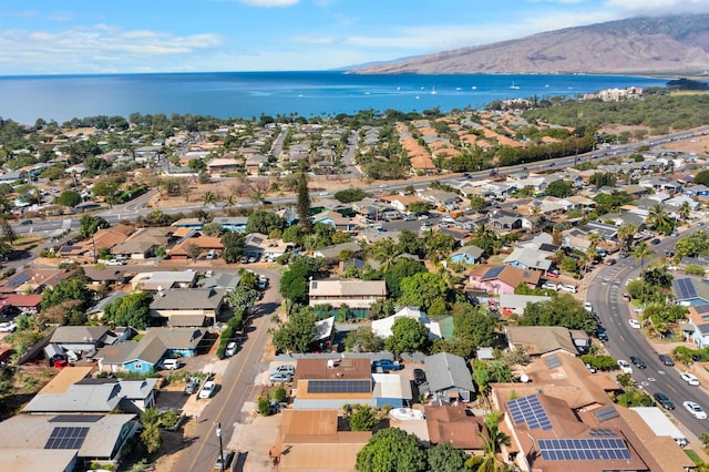 bird's eye view with a water and mountain view