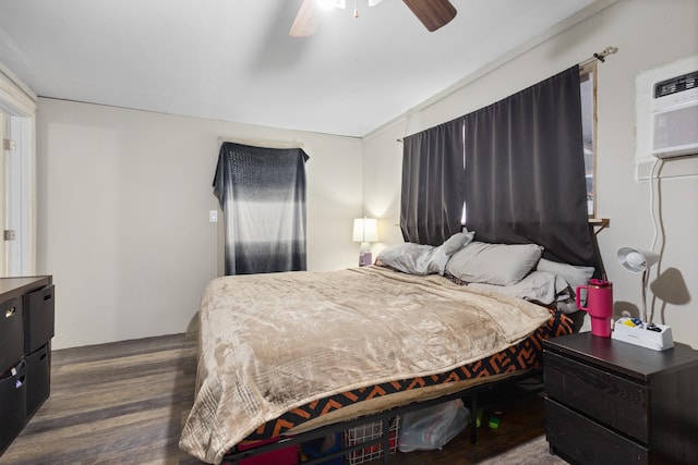 bedroom featuring ceiling fan and dark wood-type flooring