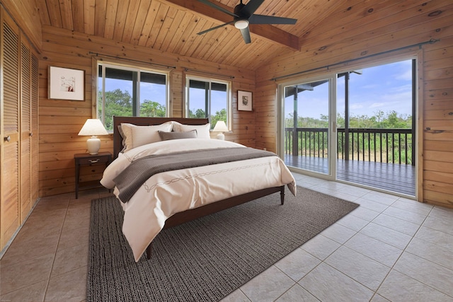 tiled bedroom featuring lofted ceiling, access to exterior, multiple windows, and wooden ceiling