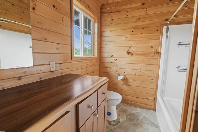 full bathroom with wood walls, toilet, vanity, and bathtub / shower combination