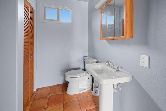 bathroom featuring toilet and tile patterned floors