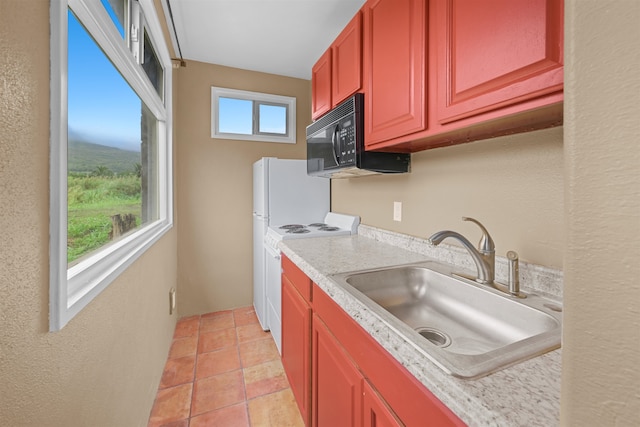 kitchen with white electric range oven, sink, and light tile patterned flooring