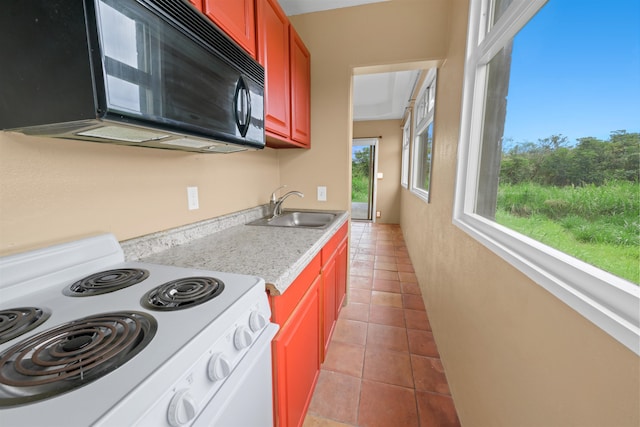 kitchen with light tile patterned floors, white electric range oven, and sink