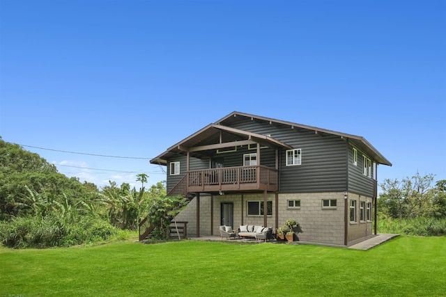 back of house featuring a patio and a yard