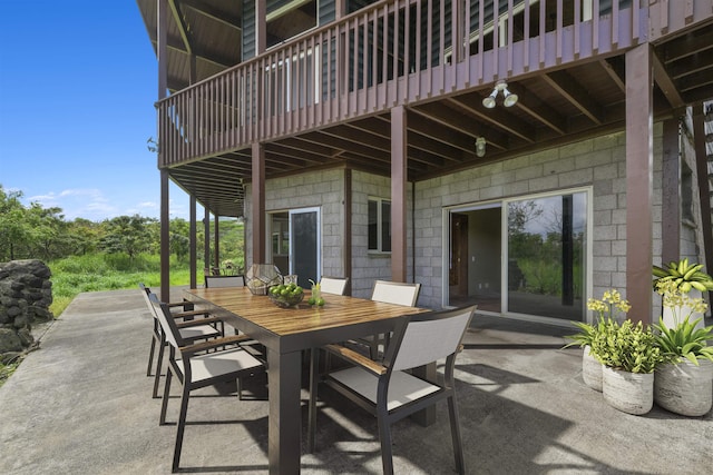 view of patio featuring a balcony