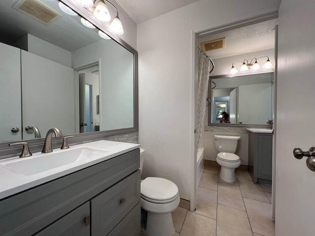 480 Kenolio Rd Unit 23-202, Kihei, HI 96753 - bathroom with vanity, tile patterned floors, and shower / bath combo with shower curtain