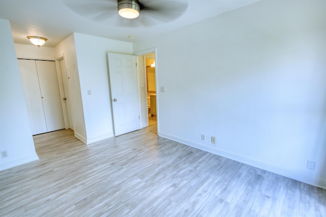 480 Kenolio Rd Unit 23-202, Kihei, HI 96753 - unfurnished bedroom with light wood finished floors and a ceiling fan