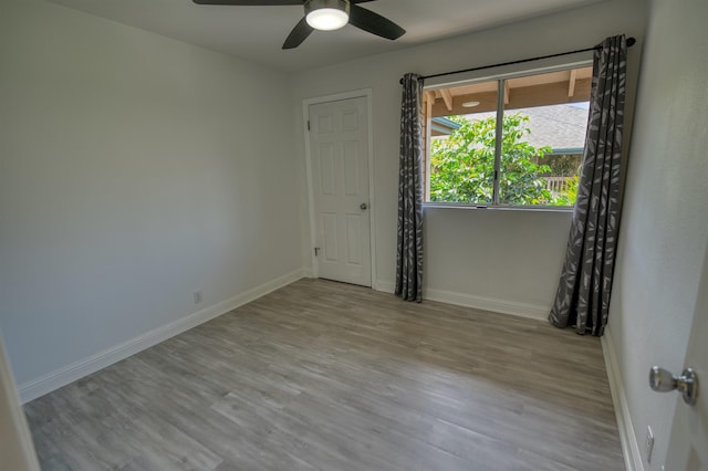 480 Kenolio Rd Unit 23-202, Kihei, HI 96753 - spare room featuring wood finished floors and a ceiling fan