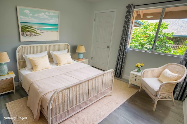 480 Kenolio Rd Unit 23-202, Kihei, HI 96753 - bedroom featuring wood finished floors and baseboards