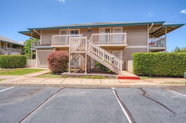 480 Kenolio Rd Unit 23-202, Kihei, HI 96753 - view of property with stairs and uncovered parking