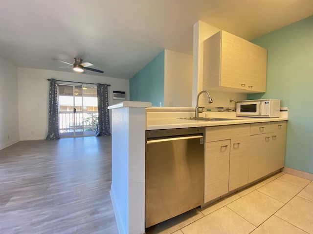 480 Kenolio Rd Unit 23-202, Kihei, HI 96753 - kitchen with stainless steel dishwasher, white microwave, open floor plan, light countertops, and ceiling fan